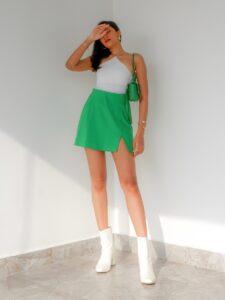 A concert avocado - Tahlia Suraj in Green mini skirt, white body suit and boots